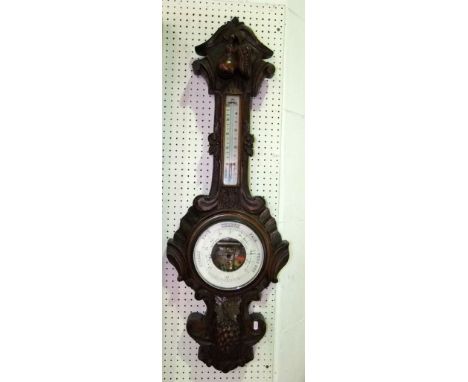 A good quality 19th century mahogany banjo wall barometer, profusely carved with fruits and grapevine and further rococo rese