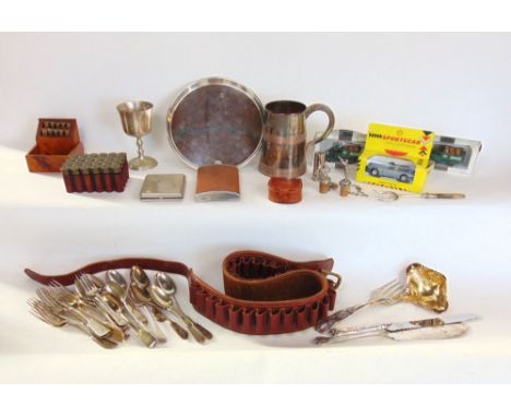 A box of metalware to include silver plate, tankard, ladle, flatware, etc., together with a fruitwood box with gun cartridges