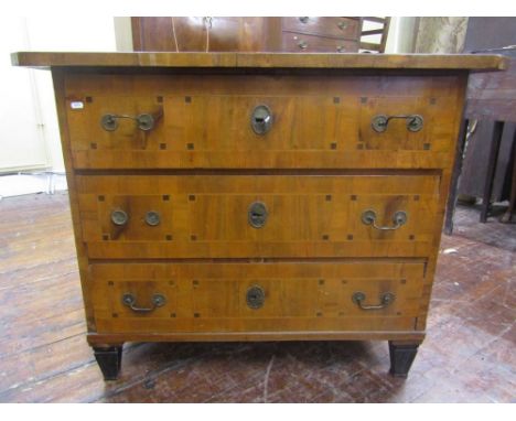 A late 18th century continental commode of three long drawers veneered in walnut with further crossbanding  detail and furthe