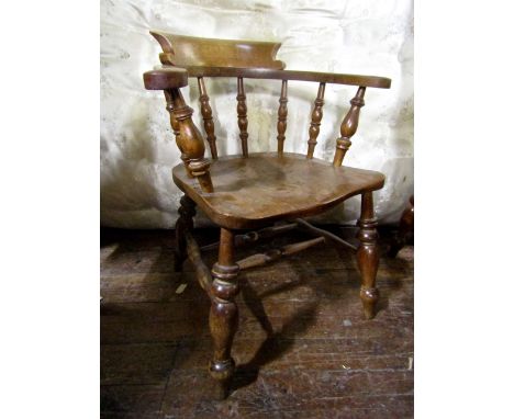 A good set of four 19th century Windsor smokers bow elbow chairs of light colour with elm seats and further turned spindle mo