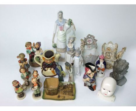 A collection of Goebel Hummell figures including a little girl knitting, a boy with umbrella, etc, a 19th century Staffordshi