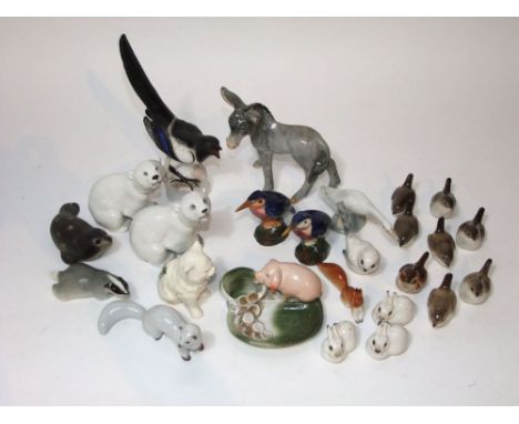 A collection of mainly USSR ceramic animals and birds including a magpie, two polar bears, rabbits, wrens, etc, together with