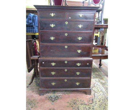 A Georgian mahogany chest on chest, six long and two short graduated drawers with brass plate handles raised on bracket suppo