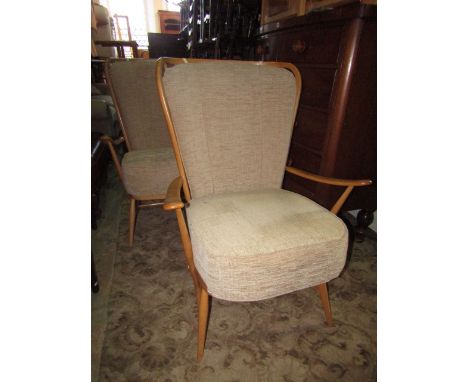 A pair of Ercol light elm Windsor lounge chairs with oatmeal upholstery (2).