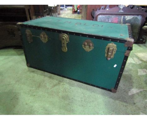 A good quality travelling trunk with green canvas band and steel fittings