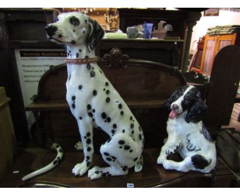 A life size ceramic Dalmatian in seated pose together with a smaller ceramic spaniel 