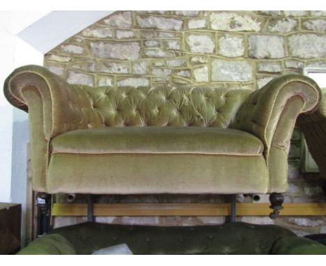 An Edwardian Chesterfield sofa with button back on turned supports, 150 cm wide