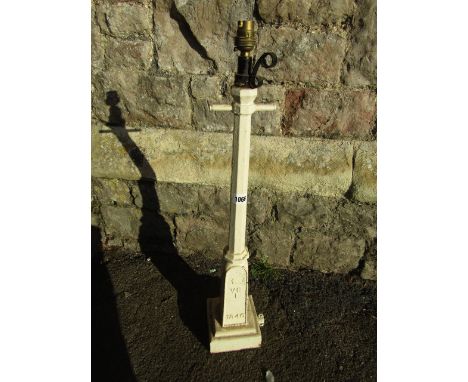 An unusual vintage cast iron lantern in the form of a Victorian street light raised on a square stepped base and with taperin