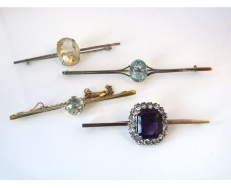 Four bar brooches comprising a 15ct example set with central aquamarine, approx 1.75cts, another in yellow metal set with cen