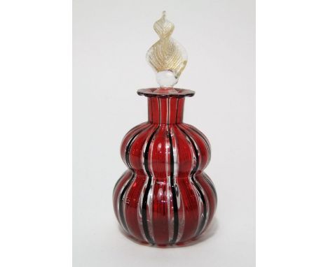 A hand blown glass scent bottle of double gourd form, possibly Italian, with lamp work striped detail in shades of red and br
