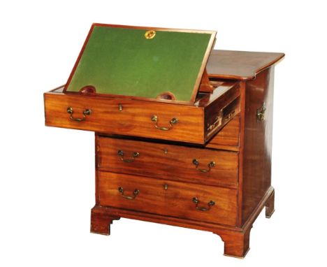A small Georgian mahogany fitted chest of four long drawers, the upper most drawer with fitted writing surface, further enclo