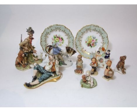 A collection of Capodimonte figure groups including a sportsmen and dogs together with a baby and dachshund on a cushion, a c