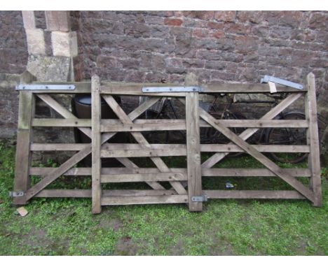 A good quality field gate and adjoining pedestrian gate with galvanised iron fittings, 4 metres 10 overall