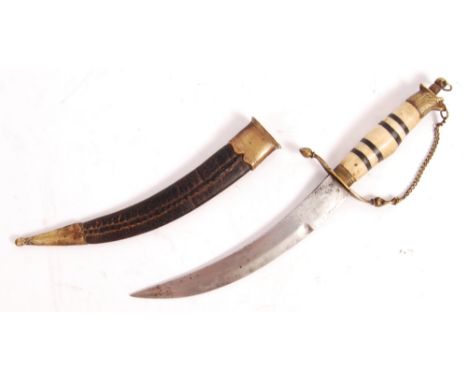 An early 19th century Georgian Indian made British Naval Dirk dagger having a bone and ebony shaped grip, eagle pommel, chain