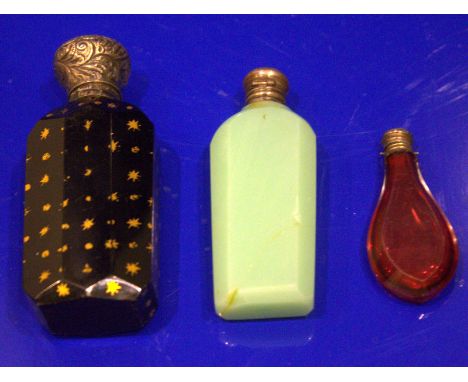 Three Victorian Scent Bottles, All With Silver Tops, One Ruby Glass Tear Shaped, The other Green Faceted And One Deep Blue Wi