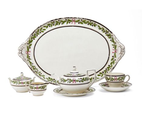  A Wedgwood 'Queen's Ware' solitaire tea service,   last quarter 19th century, painted in green and brown with a band of acor