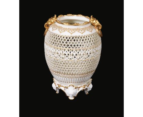  A Royal Worcester reticulated vase by  George Owen  , 1914, enriched with gilding and applied with a pair of gilt ring and m