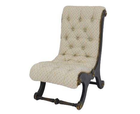 A Victorian ebonised and gilt metal nursing chair, with button upholstery, on X shaped supports.