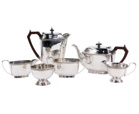 A mid-century plated four-piece tea service, of square tapering form with a gadrooned border, comprising teapot, hot water ju