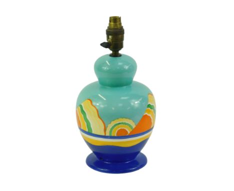 A Flosmaron pottery table lamp, of baluster form, decorated with stylised waves against a turquoise ground, on a dark blue ci