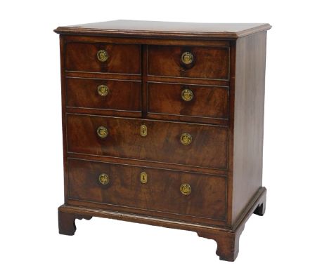 A 19thC mahogany night commode, the crossbanded top with a moulded edge, hinged to reveal a recess for a pot, etc., above fou