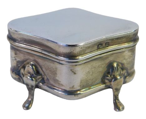 An Edward VII silver trinket box, of shaped diamond form, raised on flower capped pad feet, Birmingham 1907, 3cm high.