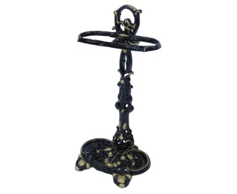 An ebonised and gilt cast iron umbrella or whip stand in Victorian style, decorated with leaves, etc., 55cm high, 28cm wide.