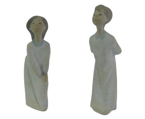 Two Nao porcelain figures, modelled as a girl and boy in nightgowns, printed marks, 20cm and 23cm high. 