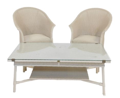 A Lloyd Loom Spalding cream coloured coffee table, with glass top, on cylindrical legs, 48cm high, 120cm wide, 59cm deep, and