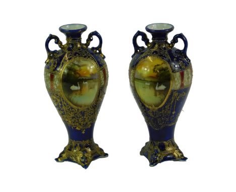 A pair of porcelain vases, in the manner of Noritake, each decorated with English or European scenes of swans, rivers, etc., 