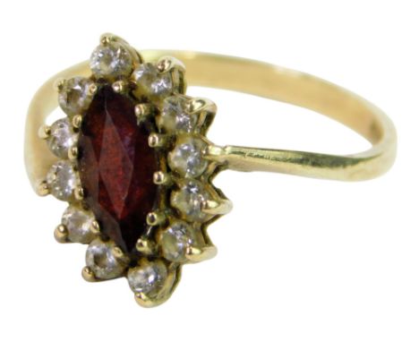 A 9ct gold ring set with garnet and CZ stones, size J/K, 1.8g.