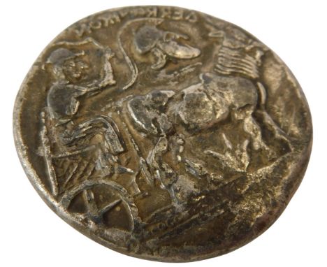 A Greek silver Tetradrachm, cast to one side with a helmeted Corinthian surrounded by three stars, the reverse with a chariot