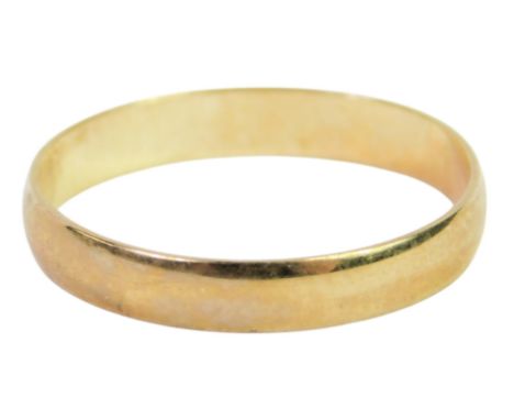A 9ct gold wedding band, size K 1/2, marked .375, 0.9g.