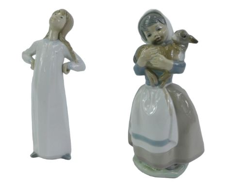 A Lladro porcelain figure of a girl wearing a nightgown, with her hands on her hips, printed marks, 22cm high, and a Nao porc