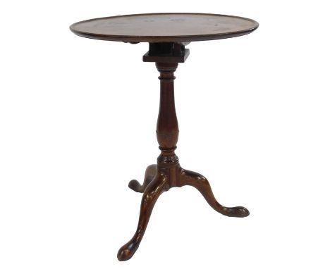 A George III mahogany occasional table, the circular dished tilt top on a turned column with bird cage, on a tripod base with