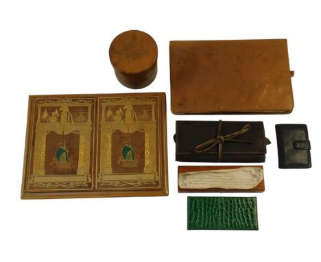 A calligraphy box, containing a quill pen, a leather desk blotter, decorated with Viking boats, etc., and other similar items