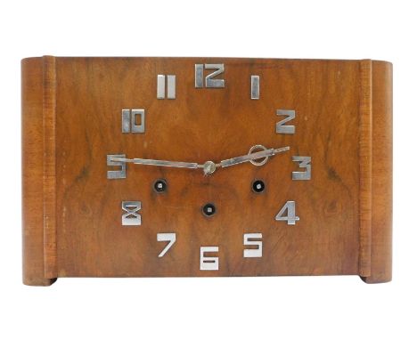 A 1930s walnut cased mantel clock, with Arabic numerals, eight day movement, with Westminster chime, with key, the case 21cm 