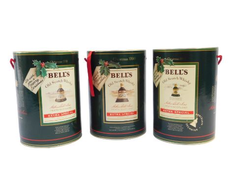 Three Bell's Scotch whisky Christmas decanters, for 1988, 1989, and 1990, all 75cl, each boxed.