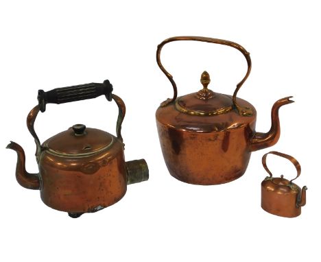 A Victorian copper kettle, 30cm high, a miniature example, 11.5cm high, together with an electric copper kettle, 25cm high. 