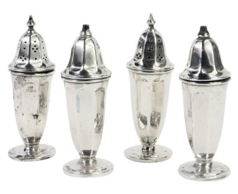 A pair of George VI silver pepper pots and salts, each of urn form, and on a circular foot, Viners Ltd, Sheffield 1946, 2.93o