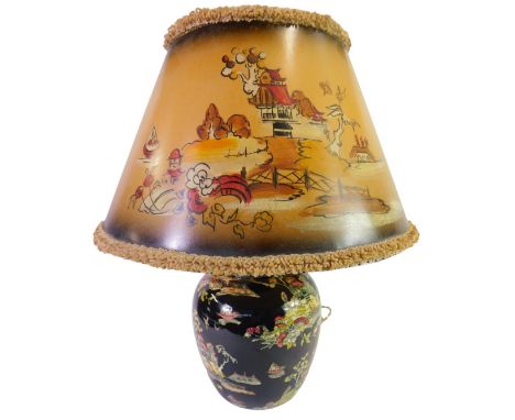 A Royal Winton pottery Pekin pattern table lamp, black ground, with a period shade, 39cm high. 
