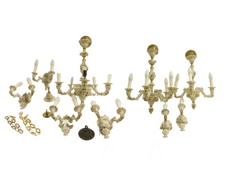 A pair of Continental porcelain five branch chandeliers, decorated with applied flowers against a white ground, gilt heighten
