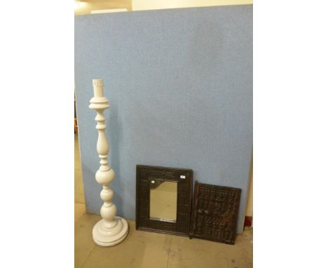 A painted standard lamp, carved oak mirror and a panel 