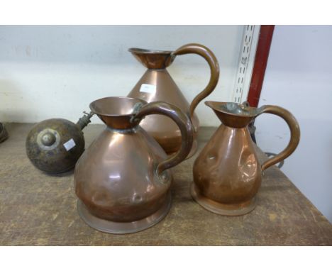 Three copper jugs and a chandelier weight 