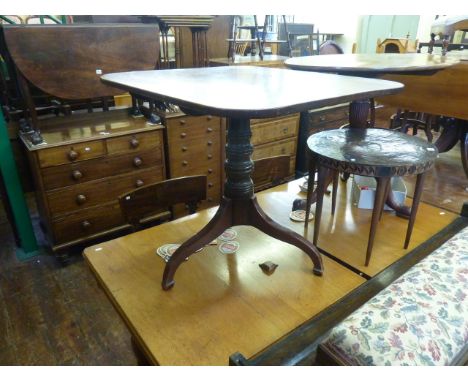 An early 19th century mahogany snap top occasional table, the rectangular top raised on a turned pillar and tripod base