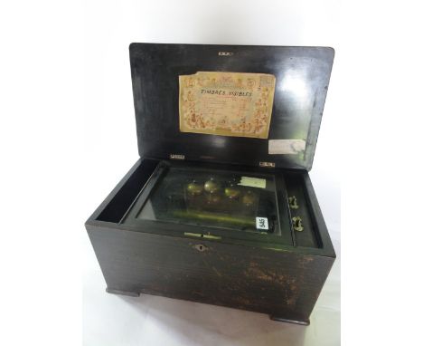 A 19th century cylinder music box playing over eight airs, the inter comb with sixty teeth, the interior plate stamped 21 275