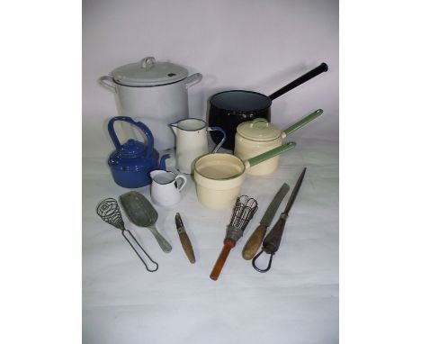 A collection of 20th century kitchenalia to include a larger lidded white enamelled storage jar, pans, jugs, etc. together wi