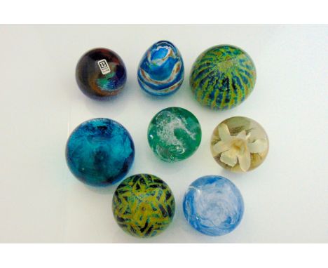 A selection of glass paperweights to include a Caithness "Spindrift" model 383/1000, a Mdina example with swirling decoration