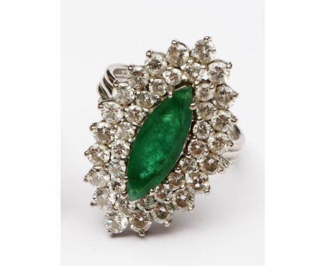 An emerald and diamond ring, centred with a marquise-cut untested emerald weighing approximately 1.14cts, within two borders 