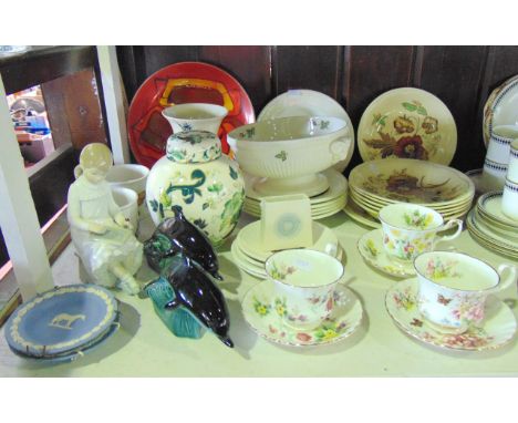 A collection of ceramics including a Poole Pottery orange ground plate with yellow and brown abstract detail, two Poole Potte